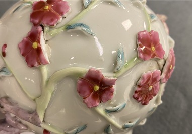 A pair of Chinese famille rose relief-decorated teapots with floral design, Yongzheng
